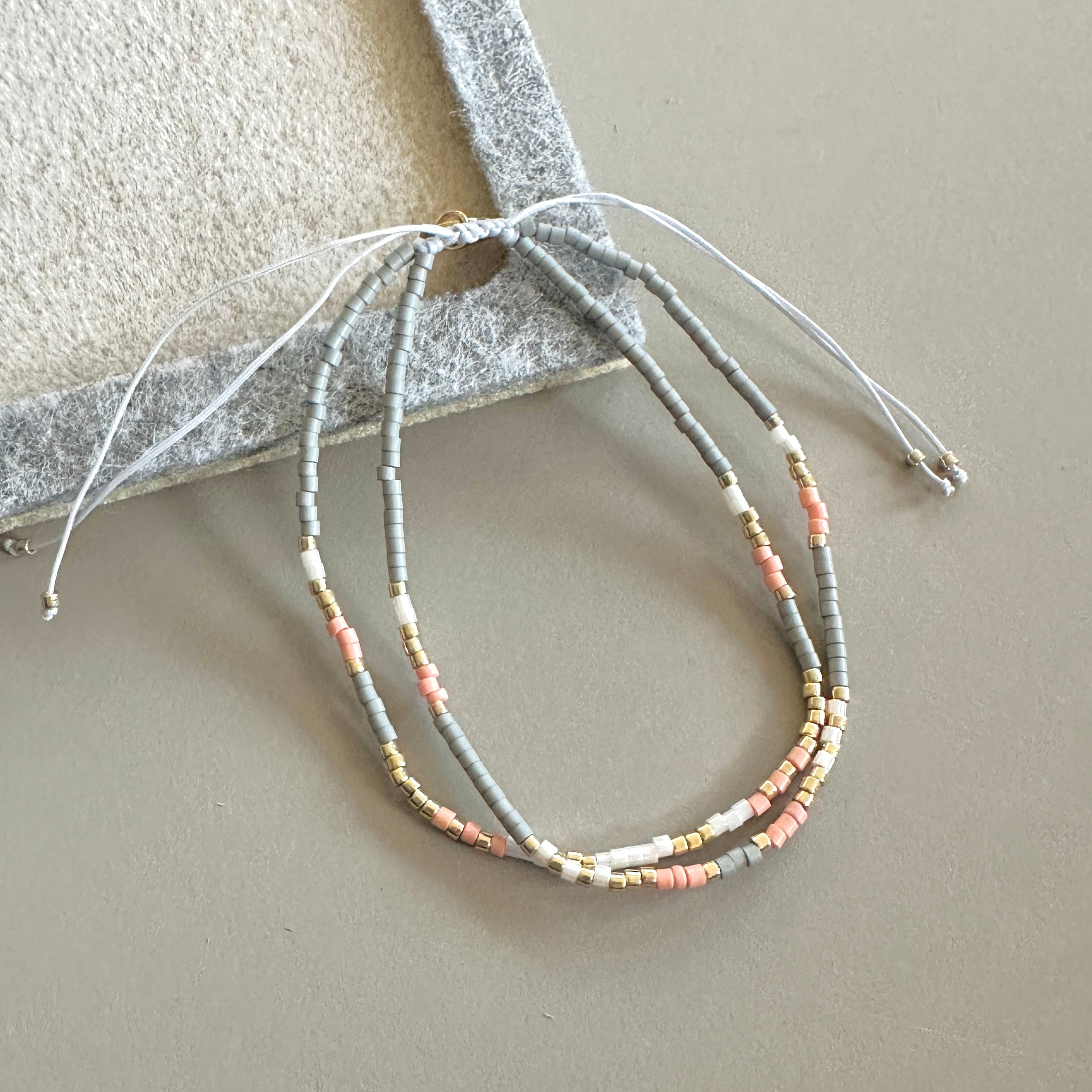 PULSERA DOBLE GRIS ROSA Y DORADO | LUNAM