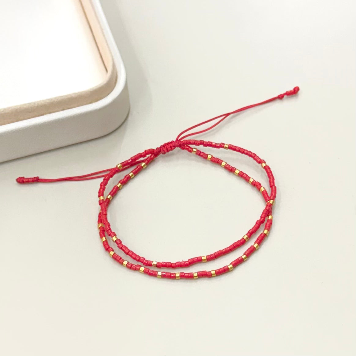 PULSERA DOBLE ROJA Y DORADO | LUNAM