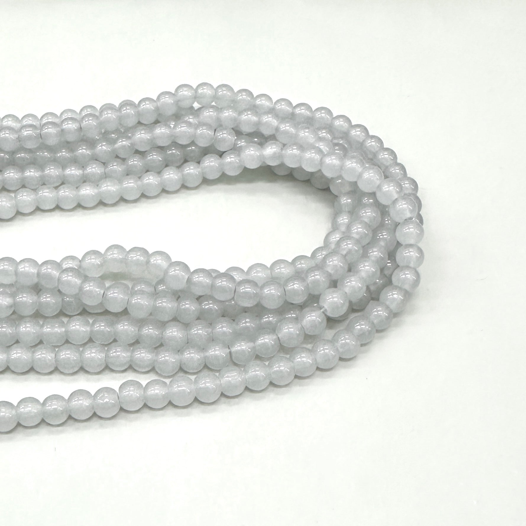 PERLA DE VIDRIO | 6MM | GRIS TRASLÚCIDO