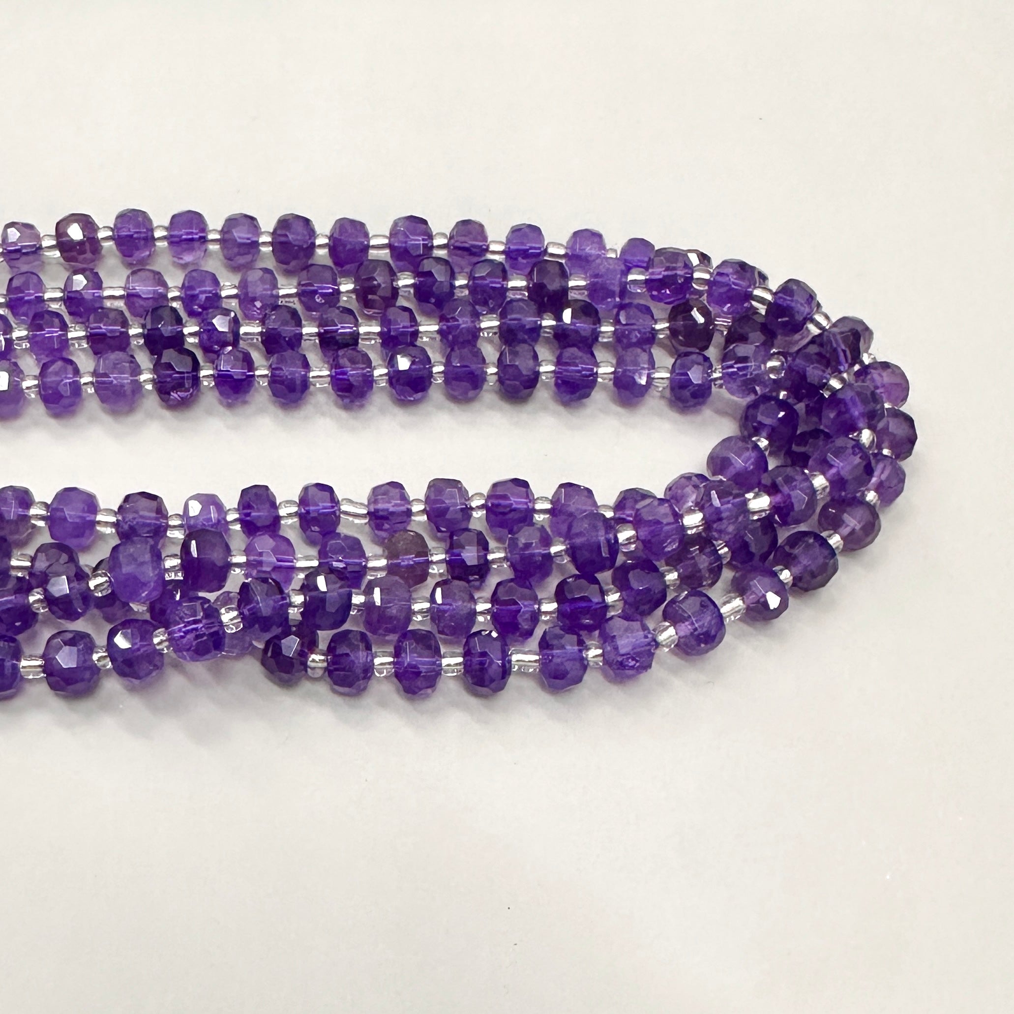 PIEDRA RONDELL FACETADA  | AMATISTA TRASLUCIDA