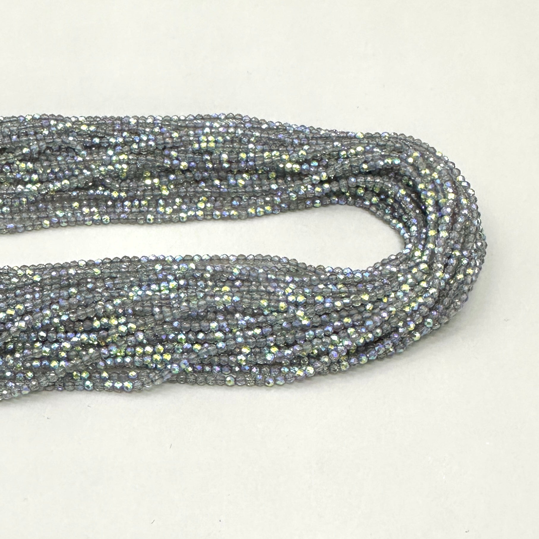 CRISTALES MINERALES FACETADO | GRIS TRASLUCIDO TORNASOL