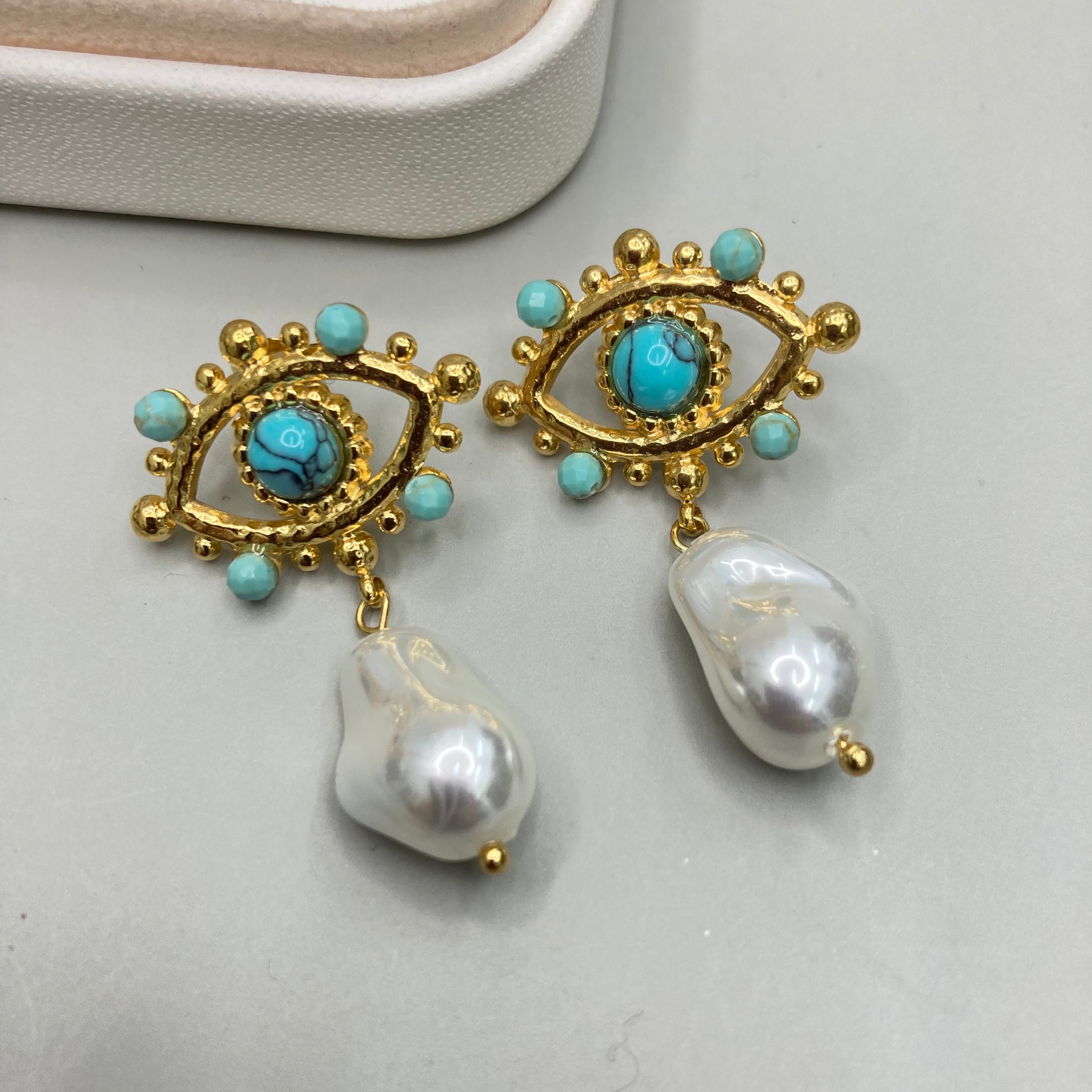AROS | DISEÑO DE OJO CON PIEDRAS Y PERLA COLGANTE