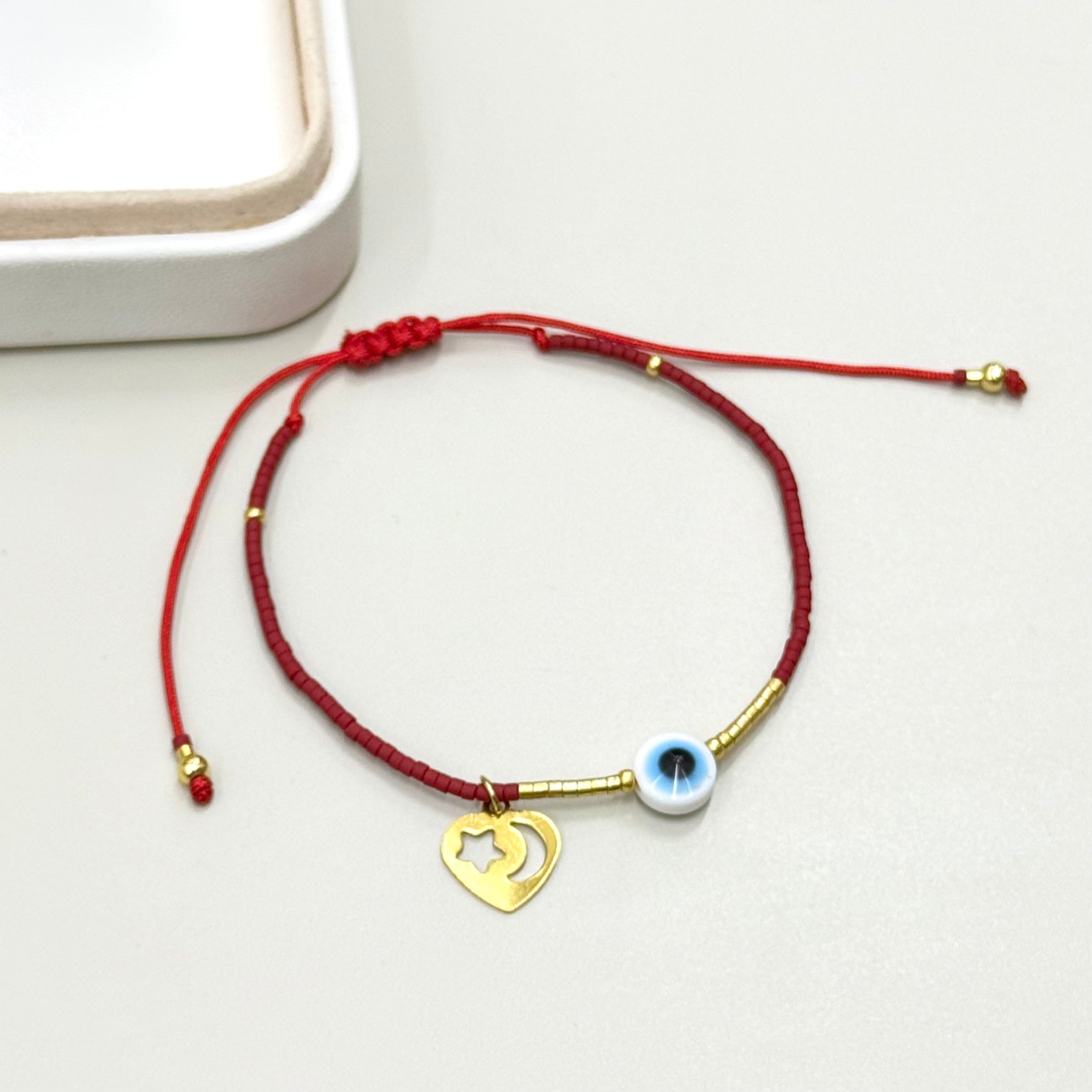 PULSERA ROJA CORAZON Y OJITO | LUNAM