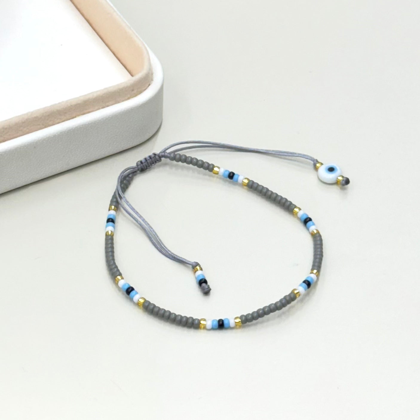 PULSERA GRIS | OJITO | LUNAM