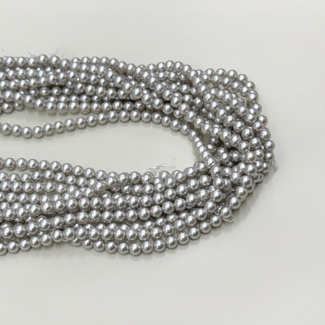 PERLA SHELL | 4MM | GRIS CLARO